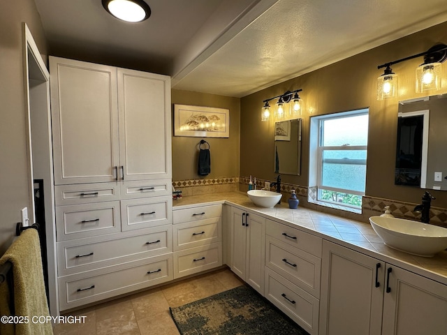 231 Main St, Seldovia, AK 99663 - bathroom featuring double vanity and backsplash