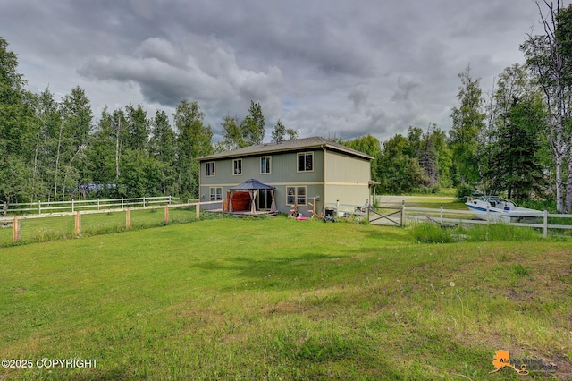 730 N Kimberly St, Wasilla, AK 99654 - back of house with a gazebo, a fenced backyard, and a wooded view
