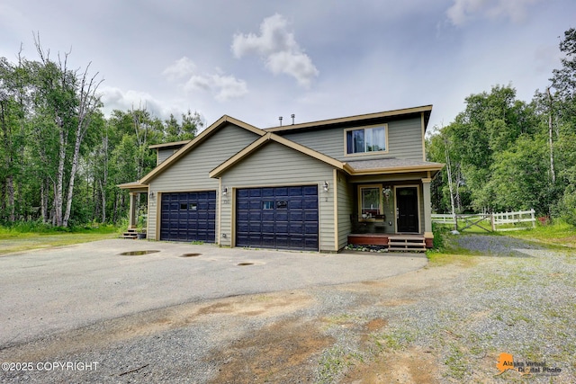 730 N Kimberly St, Wasilla, AK 99654 - view of front facade featuring driveway and covered porch