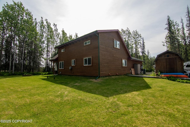 47000 Lexington Ct, Kenai, AK 99611 - view of side of home with a yard and a shed