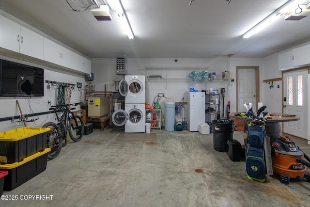 47000 Lexington Ct, Kenai, AK 99611 - garage featuring stacked washer / dryer and a garage door opener