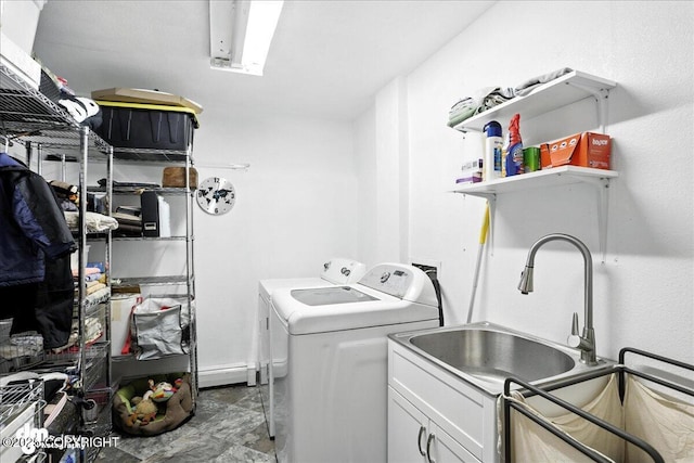 6622 Lakeway Dr, Anchorage, AK 99502 - laundry area featuring washing machine and dryer, cabinet space, and a baseboard heating unit