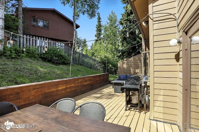 6622 Lakeway Dr, Anchorage, AK 99502 - deck featuring outdoor dining area, a fenced backyard, and area for grilling