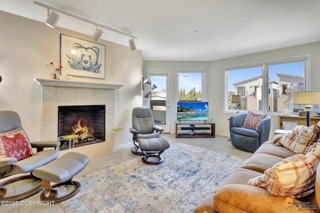 1200 I St Unit 314, Anchorage, AK 99501 - tiled living area featuring track lighting and a fireplace