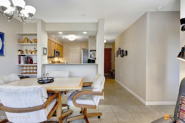 1200 I St Unit 314, Anchorage, AK 99501 - dining area with light tile patterned floors, a chandelier, and recessed lighting