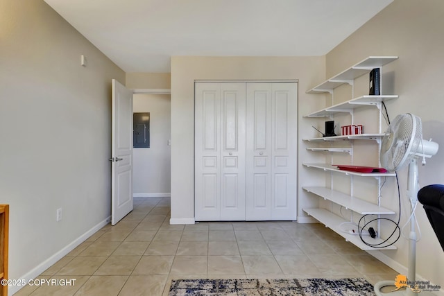 1200 I St Unit 314, Anchorage, AK 99501 - bedroom with electric panel, light tile patterned floors, and a closet