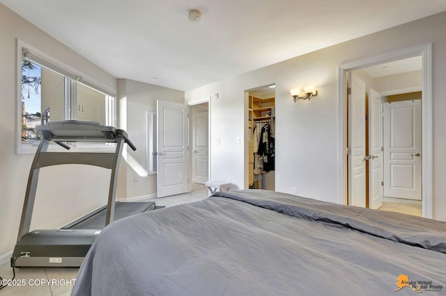 1200 I St Unit 314, Anchorage, AK 99501 - bedroom featuring light tile patterned flooring and a spacious closet