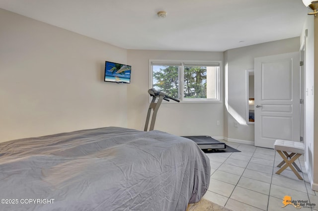 1200 I St Unit 314, Anchorage, AK 99501 - bedroom featuring light tile patterned flooring and baseboards
