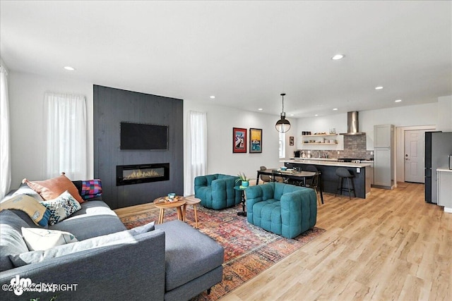 220 Susieana Ln, Kenai, AK 99611 - living area featuring recessed lighting, light wood-style flooring, and a fireplace