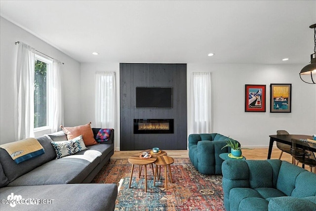 220 Susieana Ln, Kenai, AK 99611 - living room with recessed lighting, a fireplace, and wood finished floors