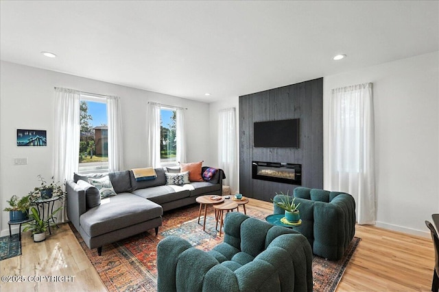 220 Susieana Ln, Kenai, AK 99611 - living room with wood finished floors, a fireplace, and recessed lighting