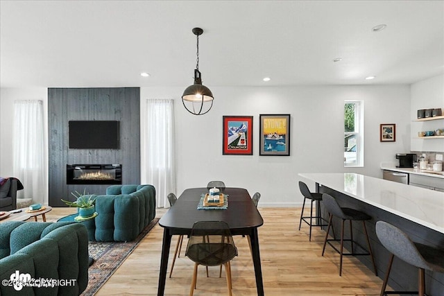 220 Susieana Ln, Kenai, AK 99611 - dining room featuring light wood-style floors, recessed lighting, and a fireplace