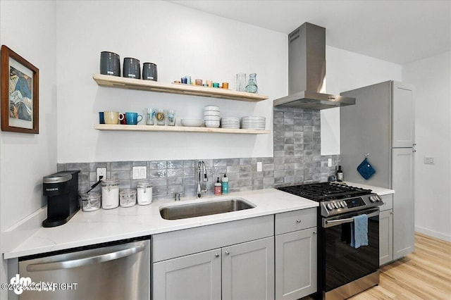 220 Susieana Ln, Kenai, AK 99611 - kitchen with extractor fan, stainless steel appliances, tasteful backsplash, and light wood-style floors