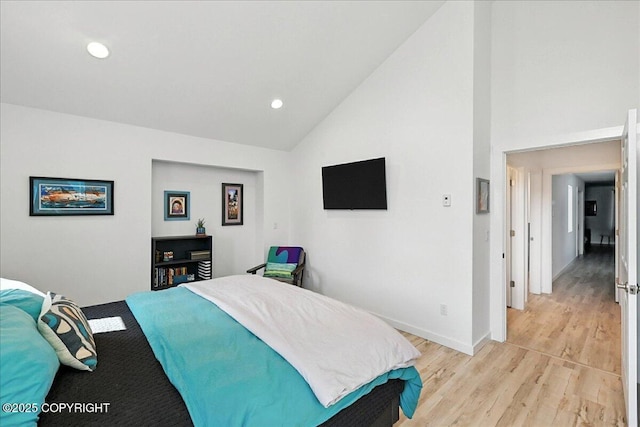 220 Susieana Ln, Kenai, AK 99611 - bedroom featuring light wood-type flooring, recessed lighting, and high vaulted ceiling