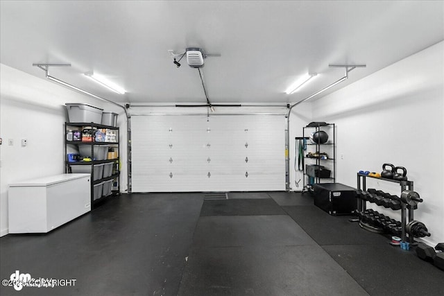 220 Susieana Ln, Kenai, AK 99611 - garage with a garage door opener and fridge