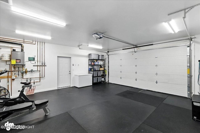 220 Susieana Ln, Kenai, AK 99611 - garage with a garage door opener and baseboards