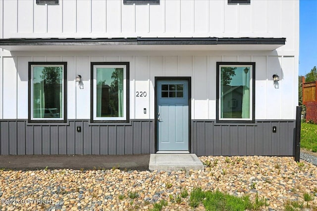 220 Susieana Ln, Kenai, AK 99611 - property entrance featuring board and batten siding