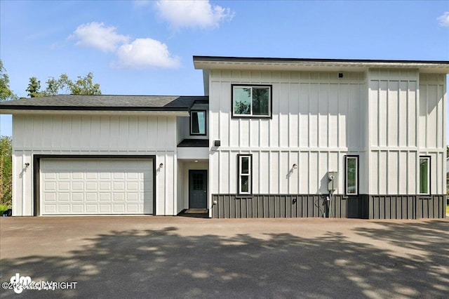220 Susieana Ln, Kenai, AK 99611 - view of front of house with driveway, a garage, and board and batten siding