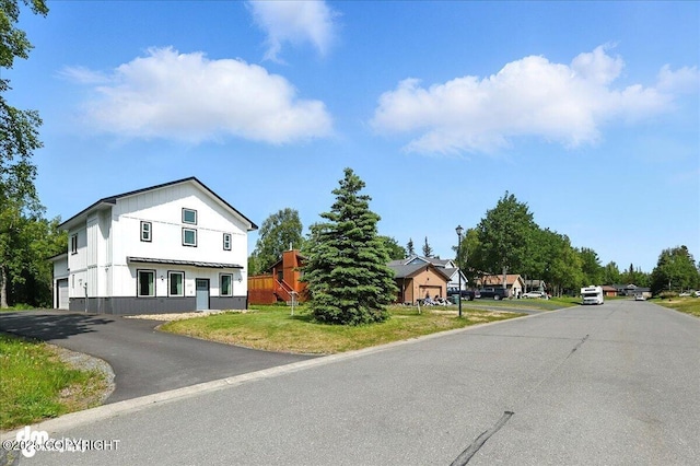 220 Susieana Ln, Kenai, AK 99611 - view of asphalt street featuring street lights