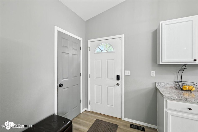 2660 N Jasper Dr, Wasilla, AK 99654 - entryway with light wood-style floors and baseboards