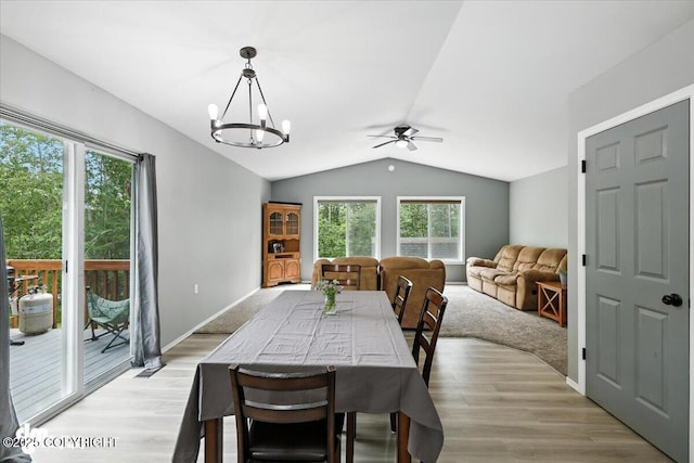 2660 N Jasper Dr, Wasilla, AK 99654 - dining space with lofted ceiling, a ceiling fan, a chandelier, and light wood-style flooring