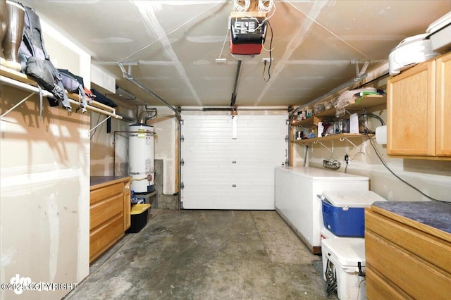 2660 N Jasper Dr, Wasilla, AK 99654 - garage featuring a garage door opener, washer and dryer, secured water heater, and refrigerator