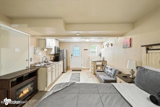 2660 N Jasper Dr, Wasilla, AK 99654 - bedroom with freestanding refrigerator and a textured wall