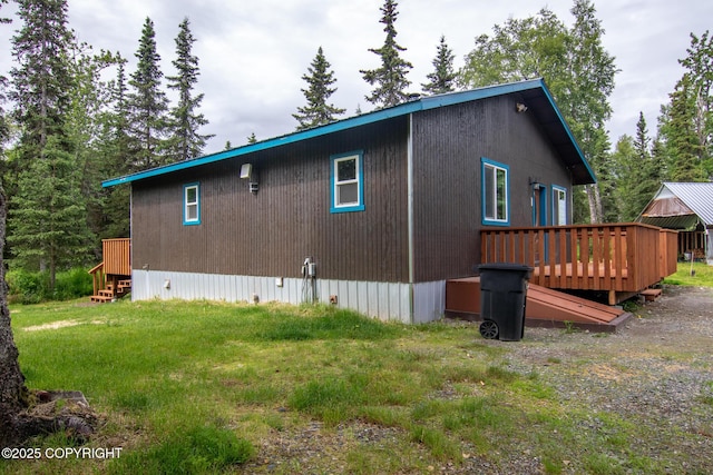 47459 Lakeside St, Nikiski/North Kenai, AK 99611 - view of side of home featuring a wooden deck and a lawn