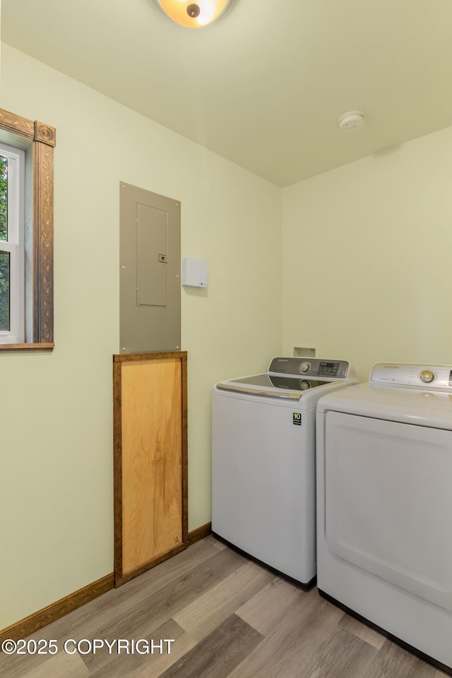 47459 Lakeside St, Nikiski/North Kenai, AK 99611 - laundry area featuring electric panel, washing machine and clothes dryer, and light wood finished floors