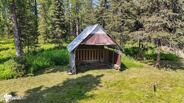 47459 Lakeside St, Nikiski/North Kenai, AK 99611 - view of grassy yard featuring a wooded view and an outbuilding