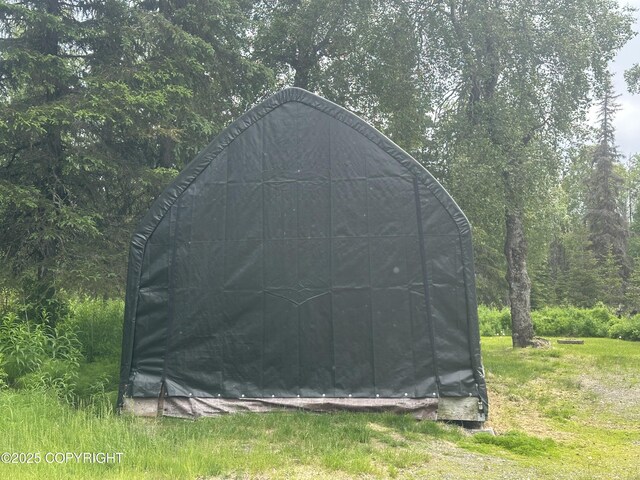 47459 Lakeside St, Nikiski/North Kenai, AK 99611 - view of outbuilding with a wooded view