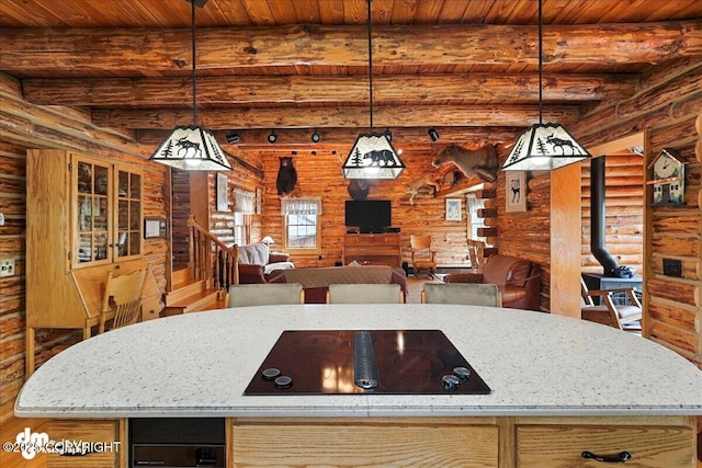 34035 Keystone Dr, Soldotna, AK 99669 - kitchen with rustic walls, black electric cooktop, a wood ceiling with exposed beams, decorative light fixtures, and wood finished floors