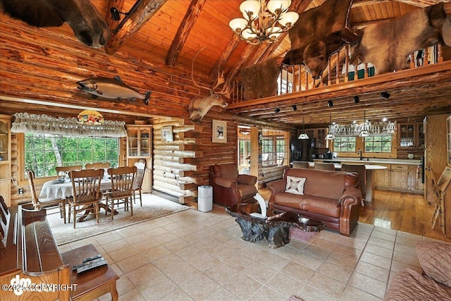 34035 Keystone Dr, Soldotna, AK 99669 - living room featuring rustic walls, healthy amount of natural light, a wood ceiling with exposed beams, light tile patterned flooring, and a chandelier