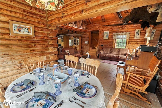 34035 Keystone Dr, Soldotna, AK 99669 - dining space featuring rustic walls and tile patterned flooring