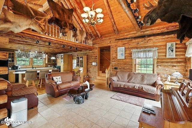 34035 Keystone Dr, Soldotna, AK 99669 - living area featuring a wood ceiling with exposed beams, high vaulted ceiling, stairway, light tile patterned floors, and a chandelier