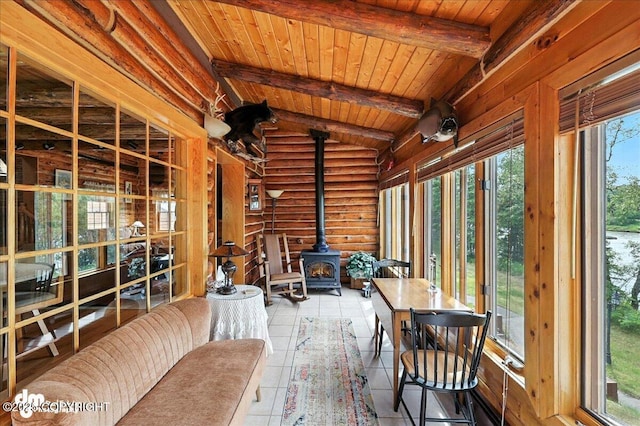 34035 Keystone Dr, Soldotna, AK 99669 - sunroom with a wood stove, wood ceiling, and tile patterned floors