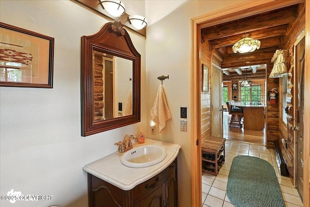 34035 Keystone Dr, Soldotna, AK 99669 - bathroom featuring tile patterned flooring, vanity, and beam ceiling