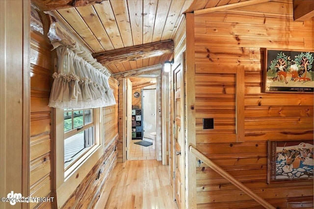 34035 Keystone Dr, Soldotna, AK 99669 - corridor featuring wooden ceiling, wood walls, and light wood-style floors
