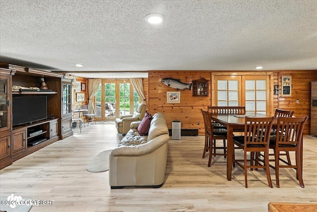 34035 Keystone Dr, Soldotna, AK 99669 - living area featuring a textured ceiling, wood walls, light wood finished floors, and recessed lighting