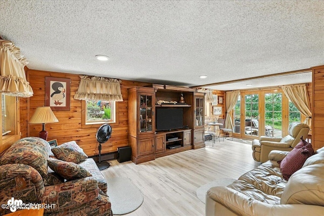 34035 Keystone Dr, Soldotna, AK 99669 - living area with a textured ceiling, wooden walls, light wood finished floors, and recessed lighting
