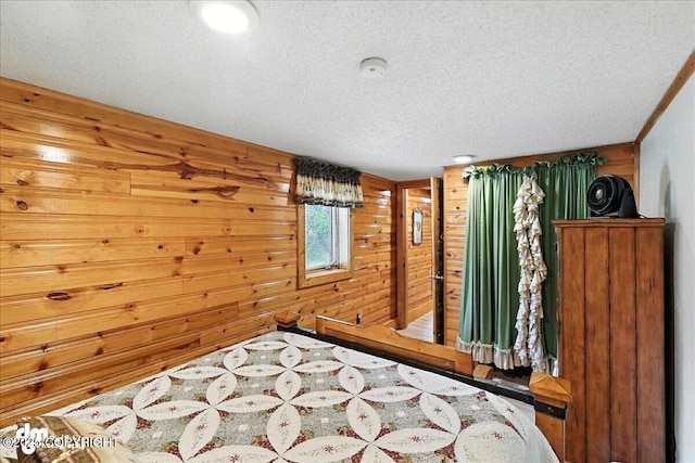 34035 Keystone Dr, Soldotna, AK 99669 - bedroom featuring wooden walls and a textured ceiling