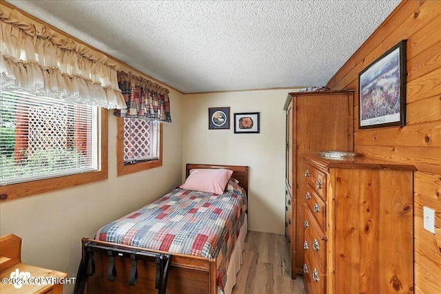 34035 Keystone Dr, Soldotna, AK 99669 - bedroom with wood finished floors and a textured ceiling