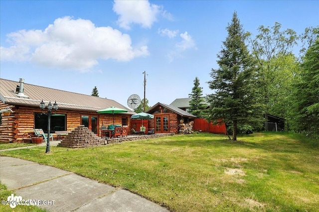34035 Keystone Dr, Soldotna, AK 99669 - view of green lawn featuring french doors and a patio