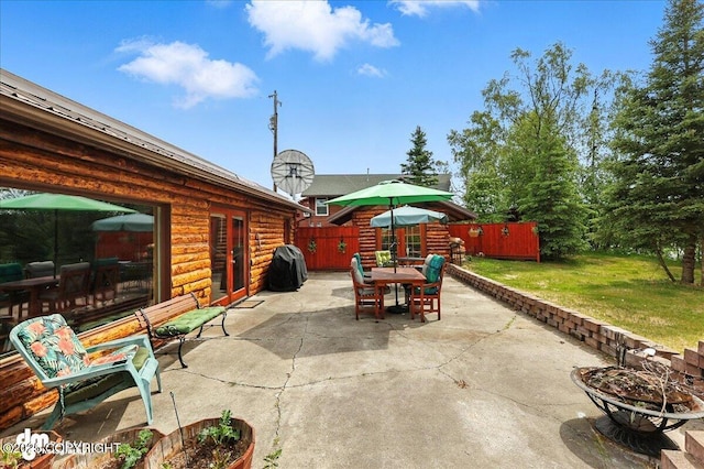 34035 Keystone Dr, Soldotna, AK 99669 - view of patio / terrace with outdoor dining area, a fire pit, and grilling area