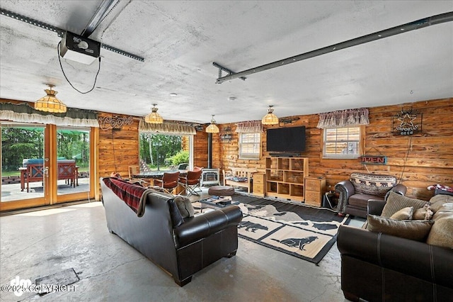 34035 Keystone Dr, Soldotna, AK 99669 - living room with unfinished concrete flooring and a wood stove