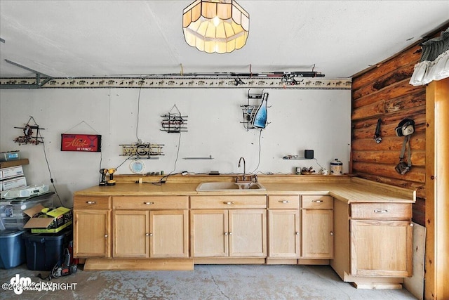 34035 Keystone Dr, Soldotna, AK 99669 - kitchen with log walls, light countertops, and light brown cabinets