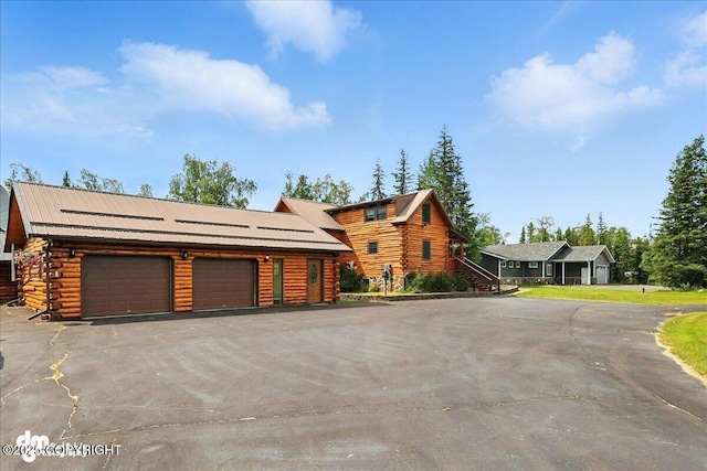 34035 Keystone Dr, Soldotna, AK 99669 - log cabin featuring log siding and a garage