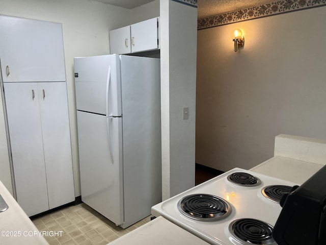 302 Sweetgale Ct # 302, Anchorage, AK 99518 - kitchen with white appliances, white cabinets, and light countertops