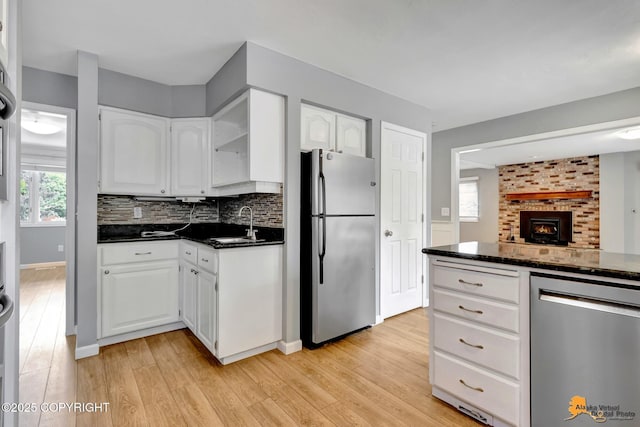 2701 Kempton Hills Dr, Anchorage, AK 99516 - kitchen featuring stainless steel appliances, light wood-type flooring, and white cabinets