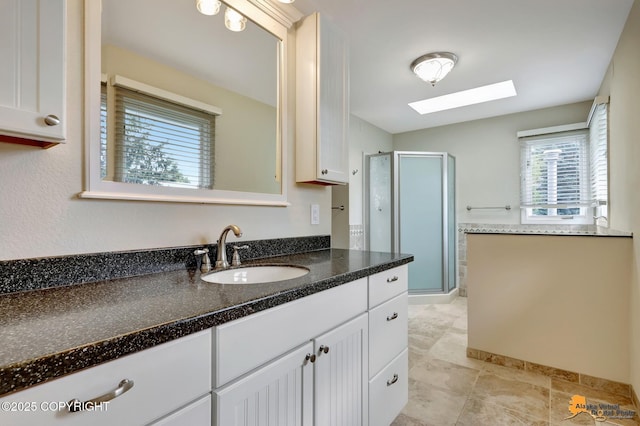 2701 Kempton Hills Dr, Anchorage, AK 99516 - full bath with a skylight, vanity, a stall shower, and tile patterned floors